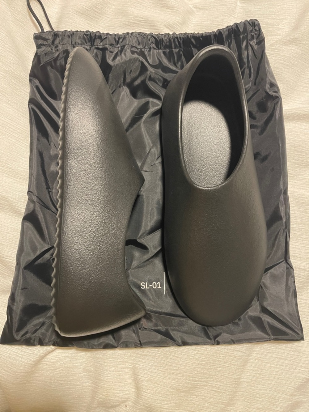 Yeezy Black Foam Slip-On Loafers.